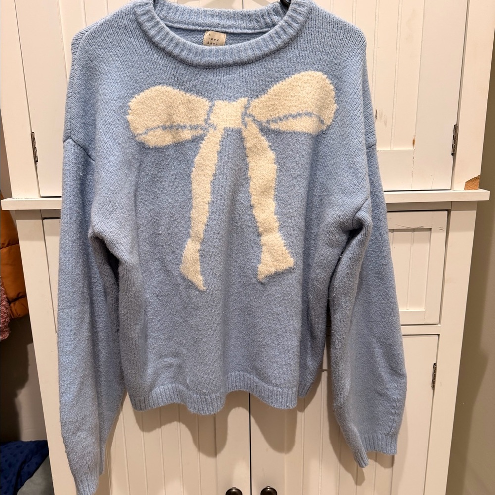 Light Blue Sweater with Cream Bow